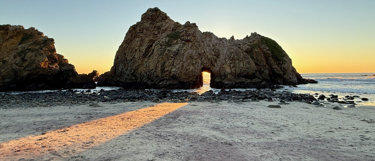 Keyhole Rock at Pfeiffer Beach, Big Sur - sunset light streaming through the natural arch